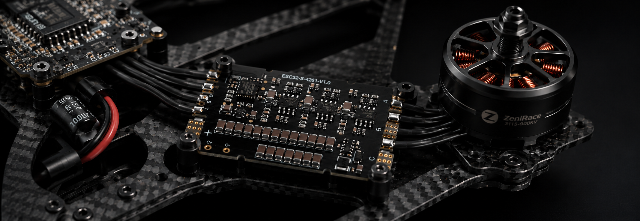 A close-up of a ZeniRace 120A Standalone ESC or motor driver board connected to a carbon fiber drone frame and a black zenirace motor, shown against a dark background.