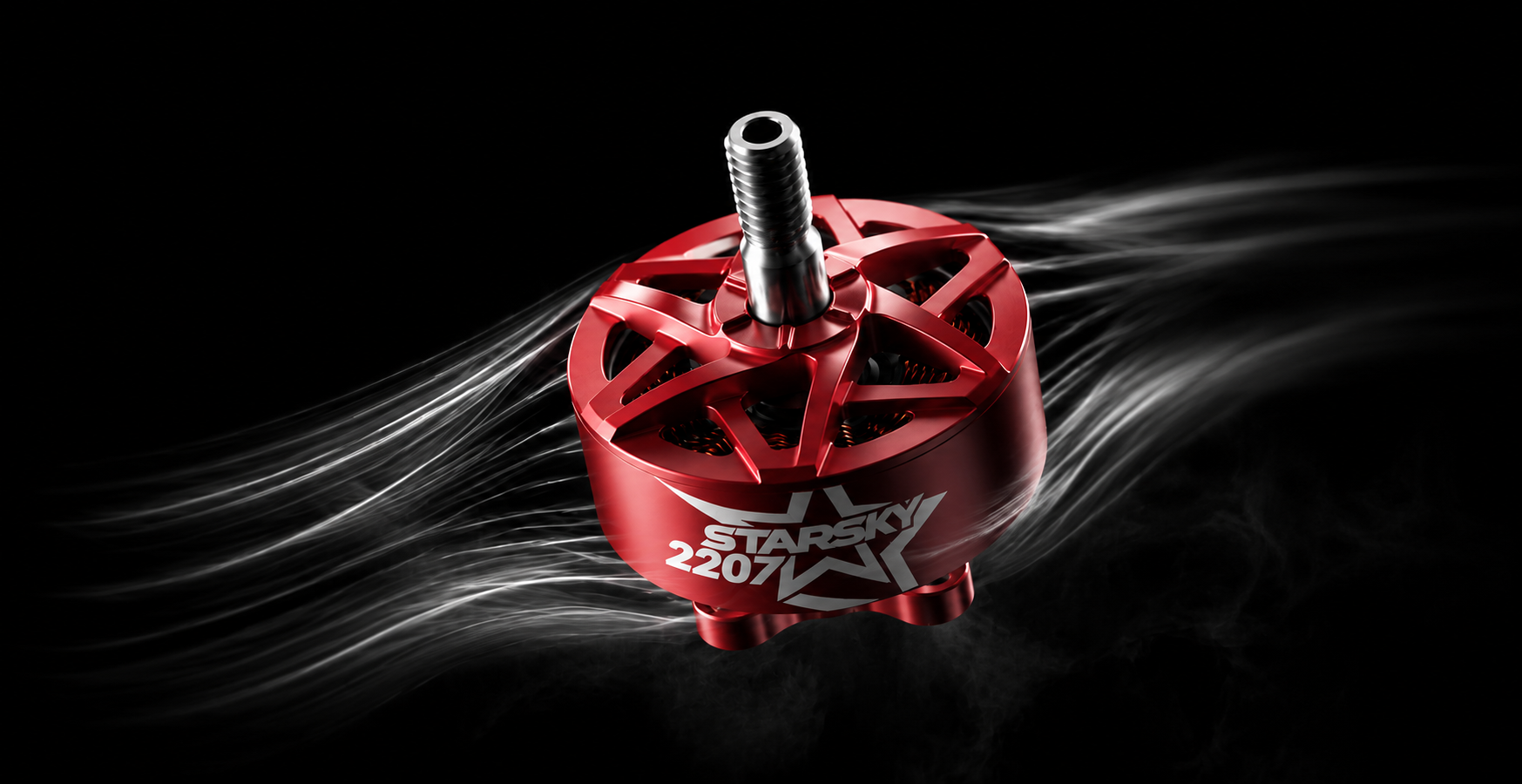 A red brushed motor with a silver shaft, featuring the 'zenirace 2207' model name on the side, set against a black background with stylized white smoke trails.