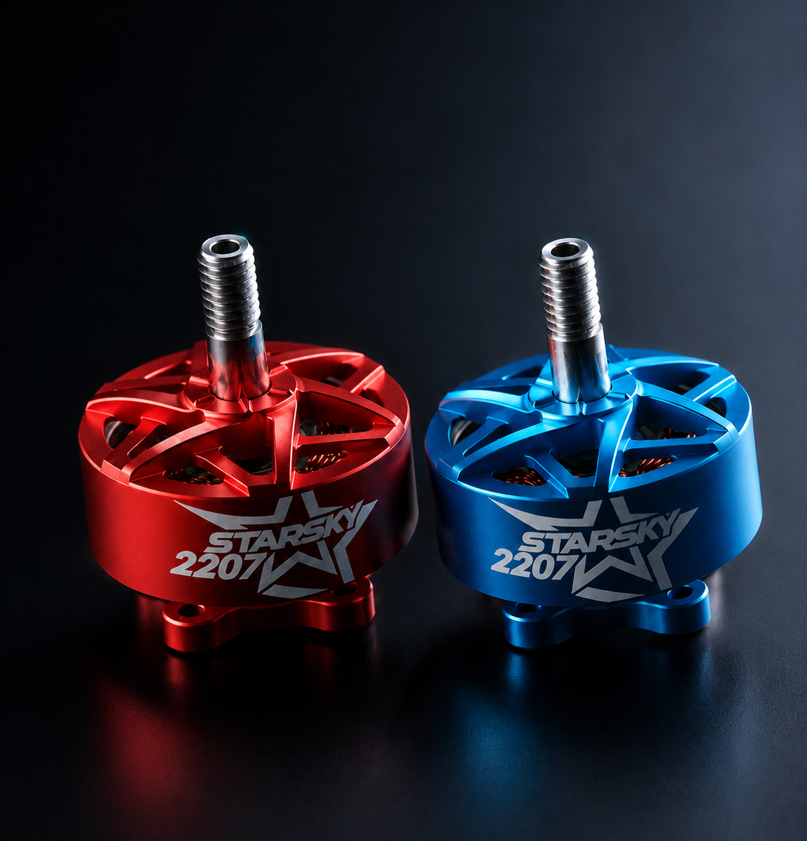 Two brushed motor axles, one anodized red and one anodized blue, both featuring a silver star-shaped hub and the 'zenirace 2207' logo, displayed on a dark reflective surface.