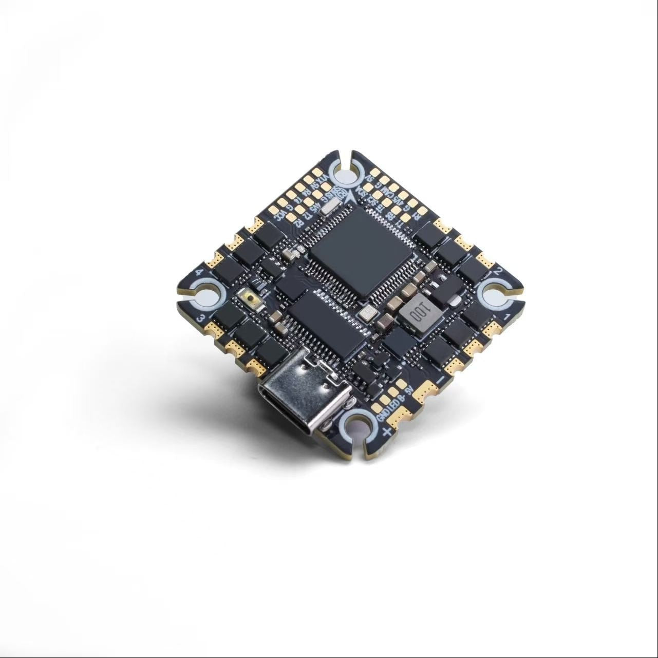 A ZeniRace F405 / F722 AIO 40A Flight Controller with a USB-C port, featuring a black PCB with gold-plated contacts and integrated circuit chips, shown on a white background.