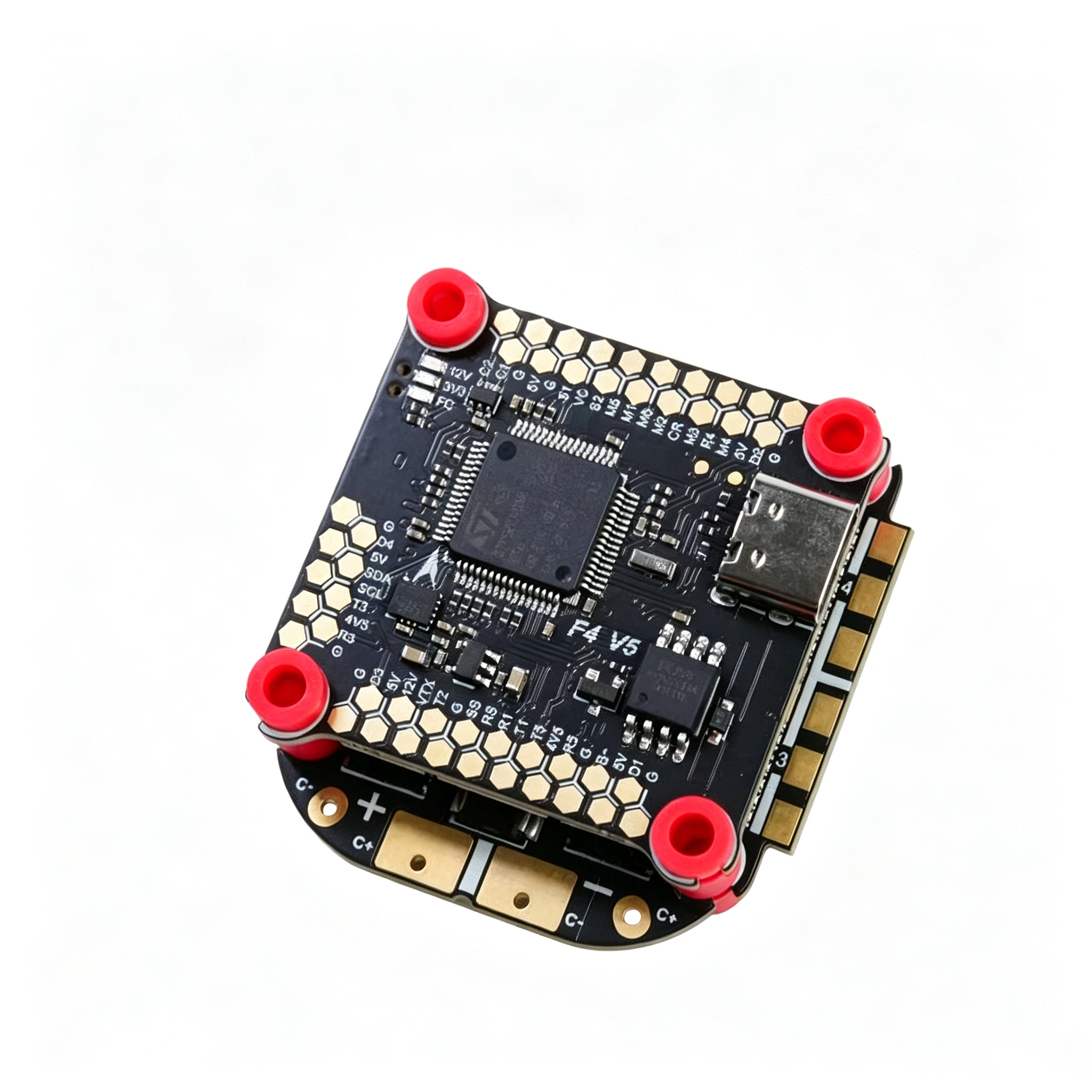A square electronic flight controller board with a black PCB, gold-plated contacts, a central microchip, a USB-C port, and four red rubber feet, shown on a white background.