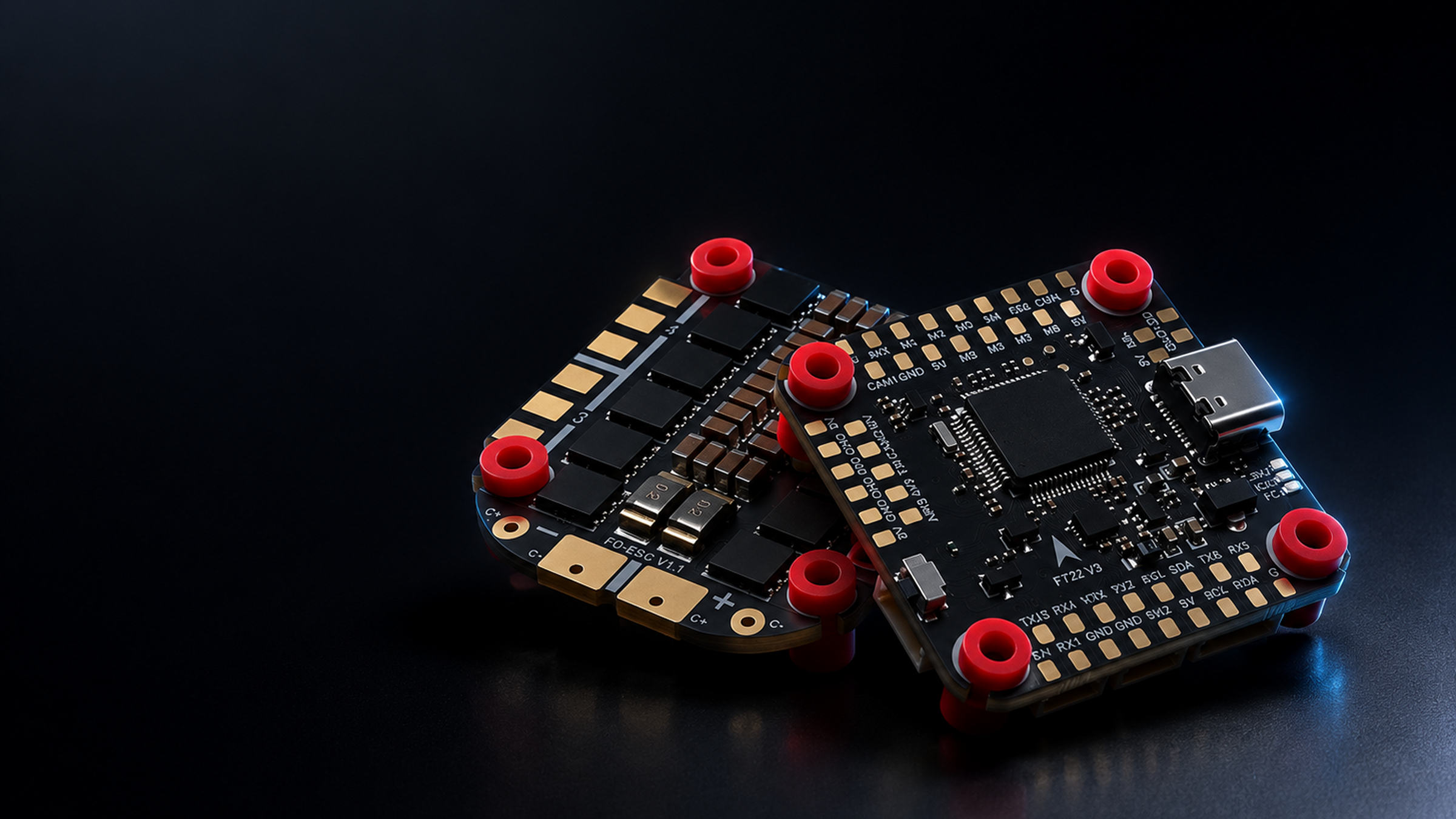 Two small electronic circuit boards with black ZeniRace F722/F405 Flight Controller, gold-plated pins, and red cylindrical connectors, photographed on a dark reflective surface.